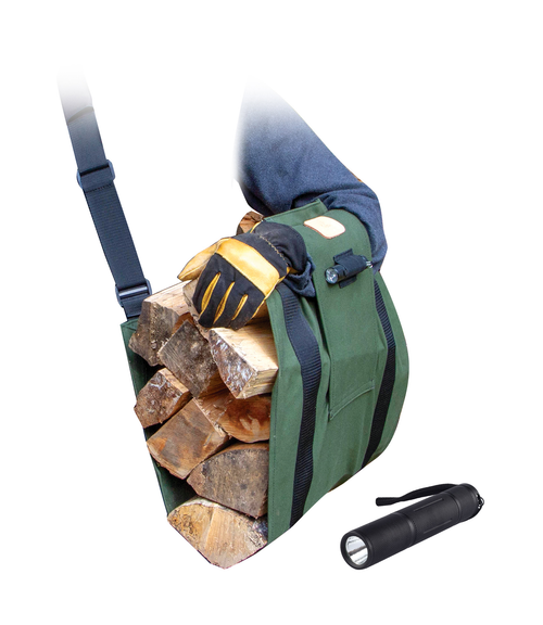 Green ergonomic firewood carrier loaded with split logs, worn on the upper arm with a padded strap, designed to distribute weight evenly; shown with a black flashlight nearby.