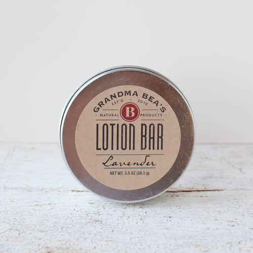Round metal tin of handcrafted lotion bar with natural lavender scent, made in USA, featured in Health & Wellness, Balms, Creams and Lotions, Grooming and Personal Hygiene, USA Made, Best Sellers, and Promo Eligible collections.