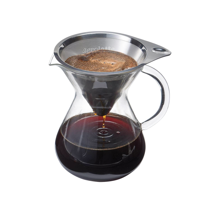 Glass coffee brewer with a stainless steel reusable micro filter brewing dark coffee, designed for manual pour-over use in kitchen and coffee brewing collections.