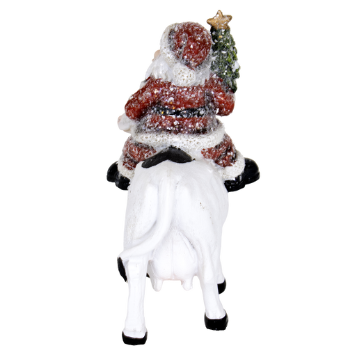 Unique handcrafted 6-inch resin figurine featuring Santa holding a Christmas tree while riding a white cow, ideal for adding festive country charm to Home & Decor, Holiday Decor, Best Sellers, and Promo Eligible collections.