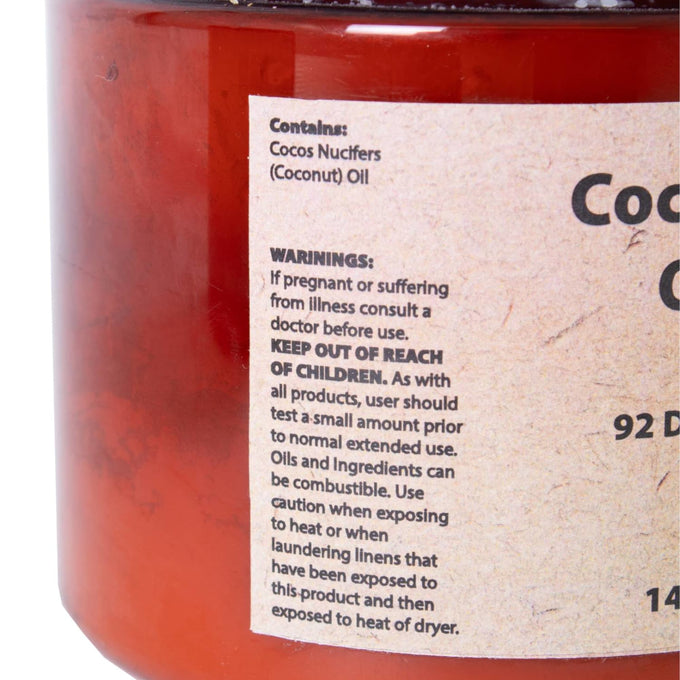 Close-up of a warning label on a container of pure coconut oil for soap making, highlighting safety instructions, child precautions, and advice for use in Health & Wellness and Soapmaking Supplies collections.