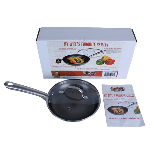 Handcrafted nitrogen hardened cast iron skillet with smooth stainless steel handle and clear tempered glass lid, shown with instructional booklet and packaging, featured in Kitchen & Food, Cookware, Cast Iron, and Best Sellers collections.