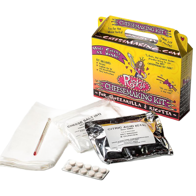 Colorful cardboard box labeled for cheesemaking kit containing sealed packets of cheese salt and citric acid, thermometer, and tablets, part of kitchen and specialty equipment collections.