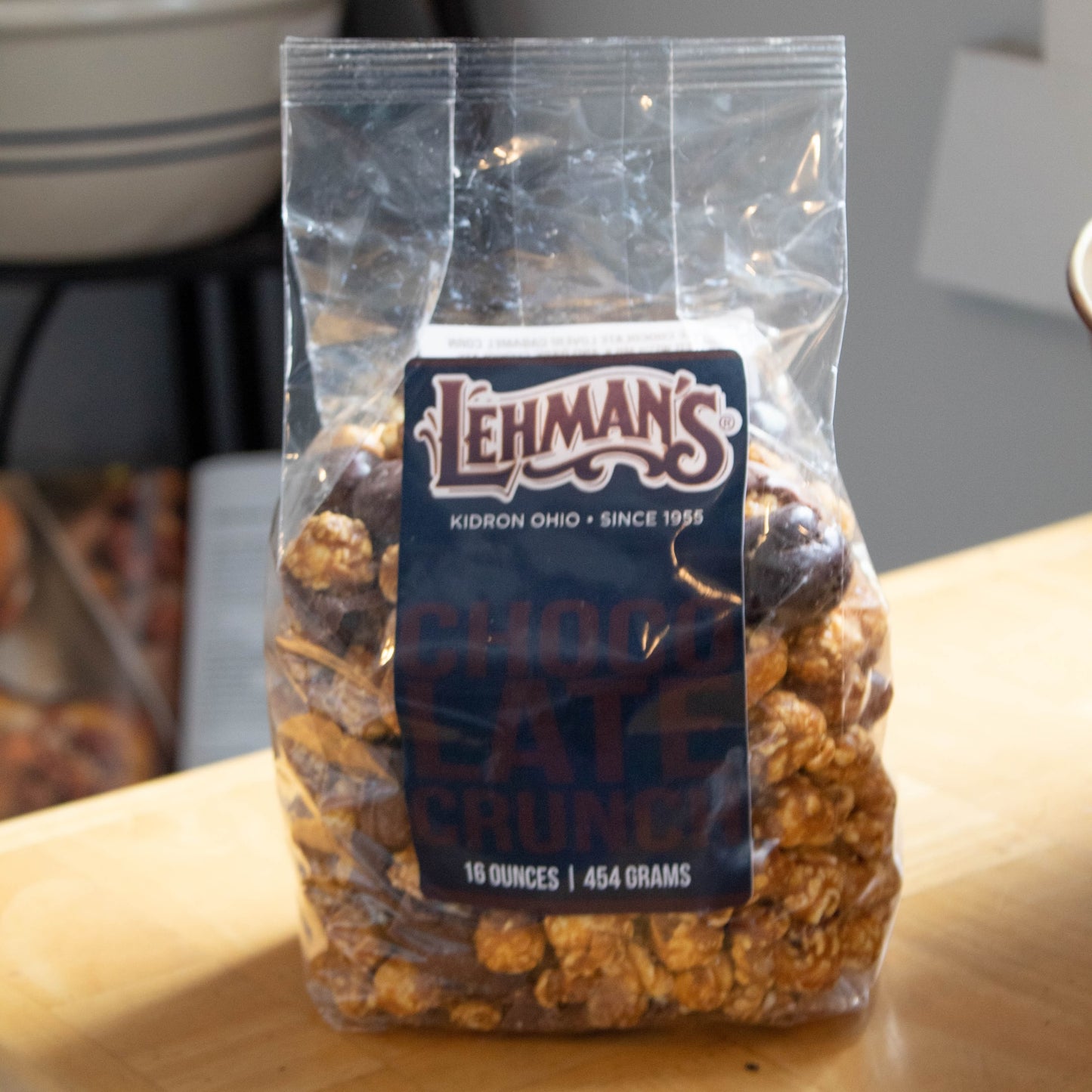 Clear bag of handcrafted Lehman's caramel popcorn crunch with chocolate coating, a unique sweet and crunchy treat made in USA, featured in Kitchen & Food, Snacks and Sweets, Popcorn, USA Made, and Best Sellers collections.