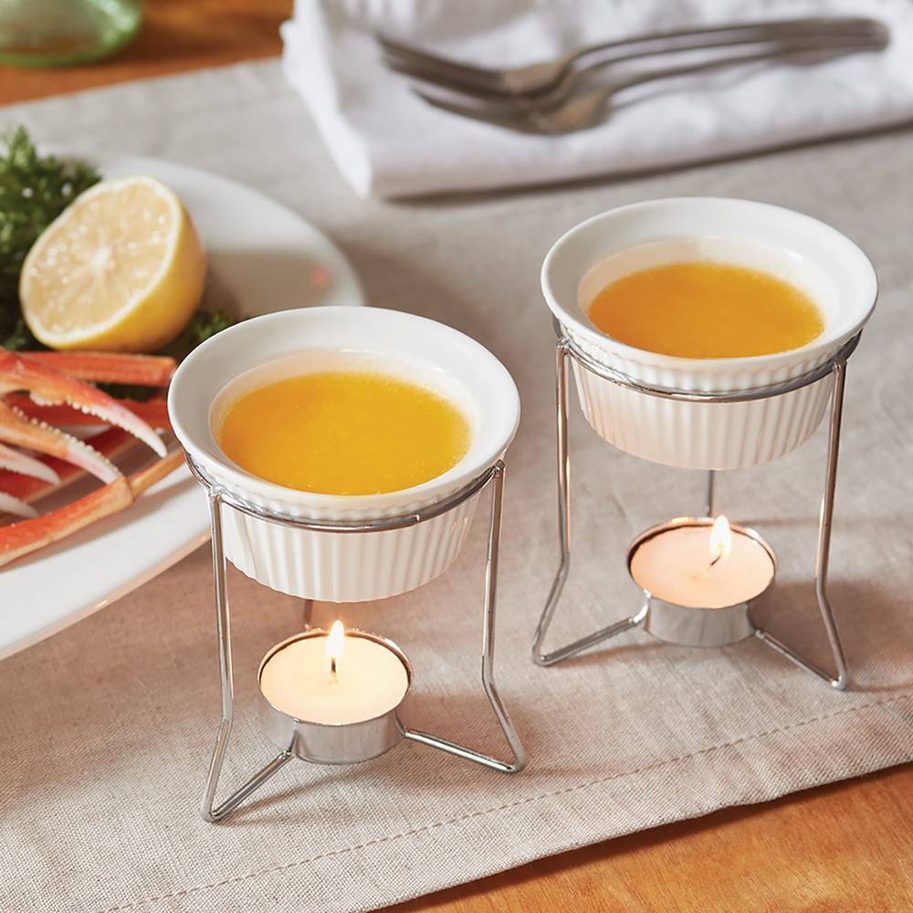 Set of 2 ceramic butter warmers held on metal stands with lit tealight candles beneath, gently warming butter or delicate sauces, featured in Kitchen & Food and Storage and Serving collections.