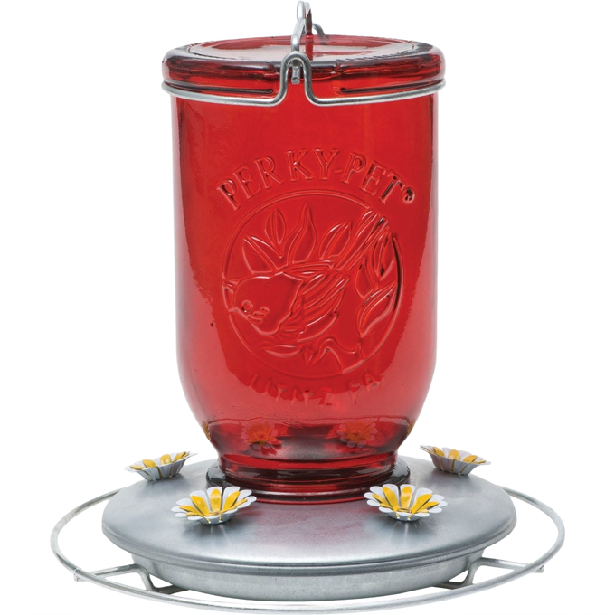 Tinted red glass hummingbird feeder with a metal base featuring flower-shaped feeding ports and a wire hanger, ideal for Farm, Garden & Tool, Animal Care, Best Sellers, and Promo Eligible collections.