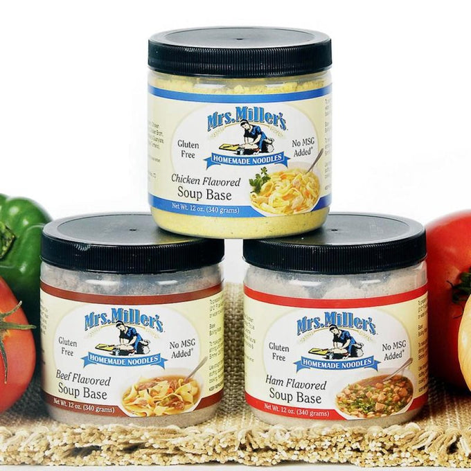 Three 12-oz canisters of handcrafted Amish-made soup bases in chicken, beef, and ham flavors, gluten-free and no MSG, displayed with fresh vegetables for Kitchen & Food, Dry Goods and Mixes, Soups, Gluten Free, USA Made, Best Sellers, and Promo Eligible collections.