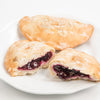 Handcrafted Amish-style fry pies with golden flaky crusts and rich blueberry filling on a white plate, perfect for Kitchen & Food, Snacks and Sweets, Holiday Hosting, and USA Made collections.