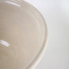 Close-up of handcrafted stoneware mixing bowl with smooth cream glaze and subtle blue band, made in the USA, perfect for Kitchen & Food, Baking Supplies, and Storage collections.