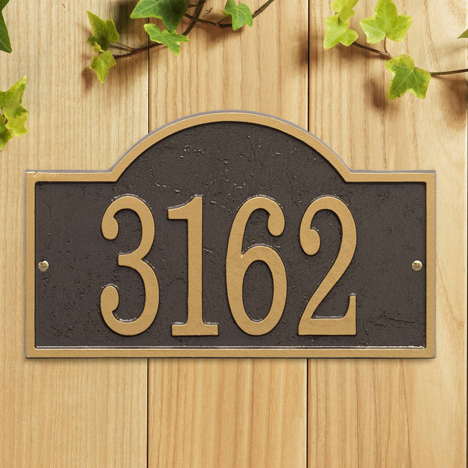 Handcrafted bronze and gold arched rectangle address plaque with raised numbers, mounted on natural wood, adding elegant curb appeal to homes in Home & Decor and USA Made collections.