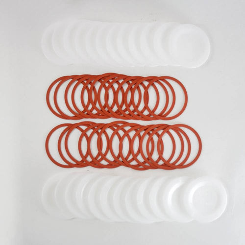 Set of reusable wide-mouth canning jar lids and orange sealing rings, designed for food preservation and kitchen use, featured in USA Made and Best Sellers collections.