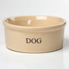 Large beige stoneware dog bowl with a glossy lead-free glaze, designed to stay put, handcrafted in the USA, suitable for pet supplies and home decor collections.