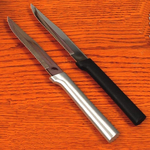 Two handcrafted serrated steak knives with high carbon surgical stainless steel blades, one featuring a solid black handle and the other a solid aluminum handle, ideal for Kitchen & Food, Knives & Axes, and USA Made collections.