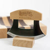 Handcrafted curved chopping knife with wooden handle engraved Lehman’s Kidron Ohio, displayed on wooden stand with striped cutting board in background, ideal for Farm, Garden & Tool and Kitchen Knives collections.