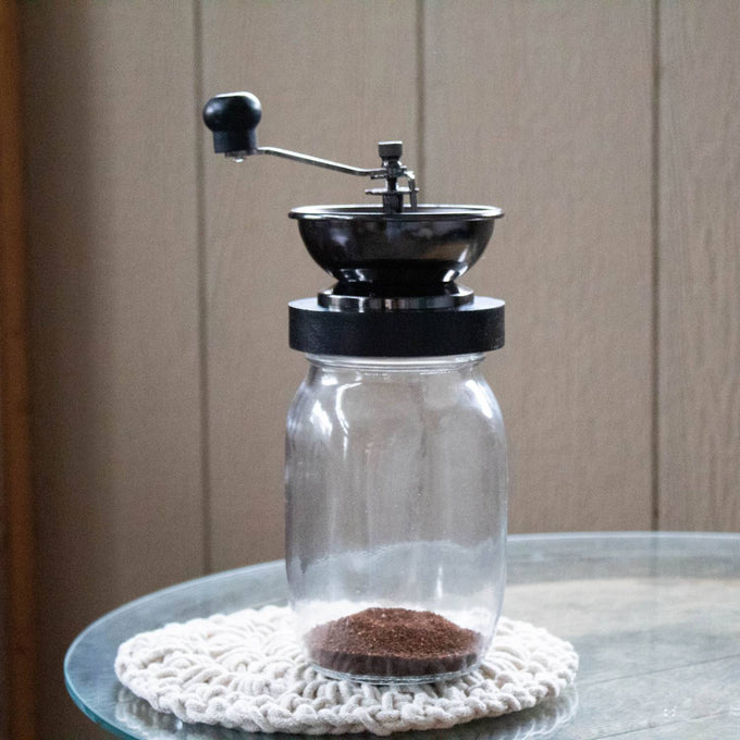 Handcrafted mason jar coffee grinder with a ceramic burr and hand crank, designed for consistent fresh coffee grinding, featured in Kitchen & Food, Brewing Coffee and Tea, Kitchen Gadgets, Kitchen Accessories, Best Sellers, and Promo Eligible collections.
