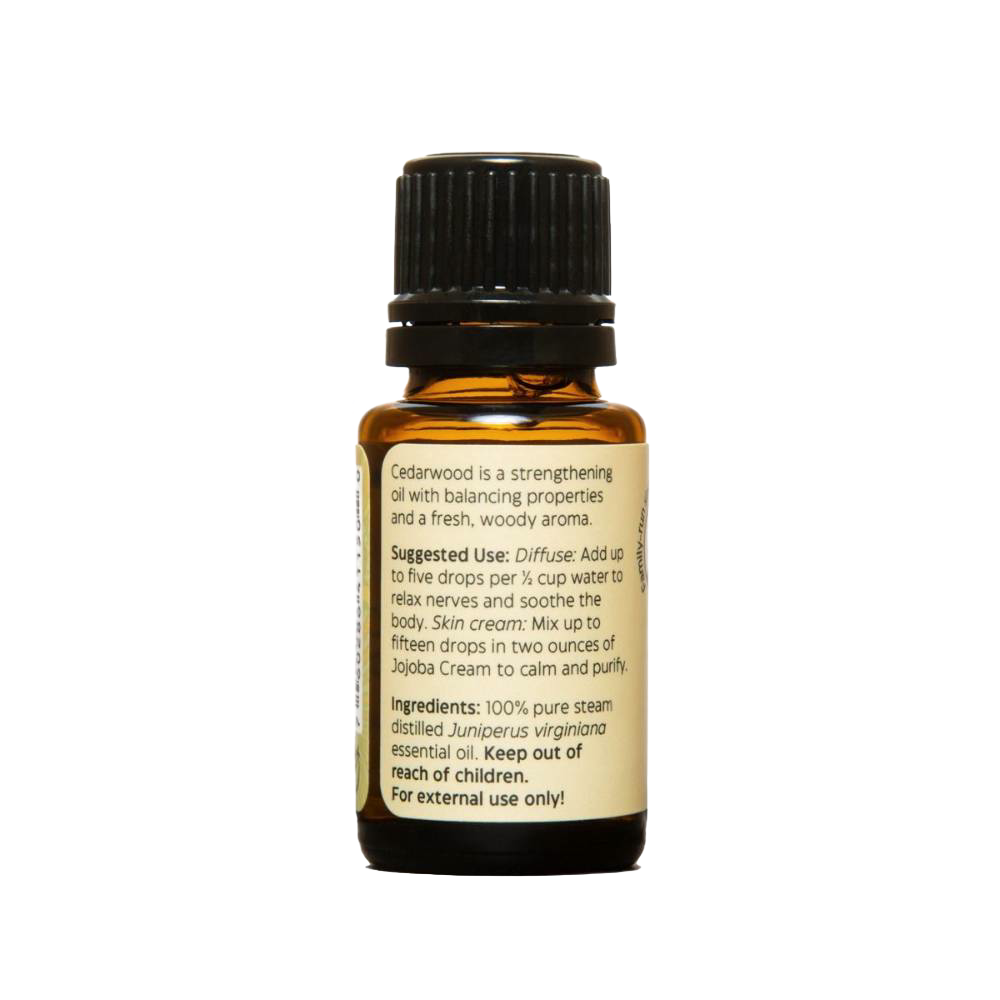 Amber glass bottle of handcrafted cedarwood essential oil with black cap and detailed label, made in USA, perfect for aromatherapy, soapmaking, candlemaking, and health remedies collections.