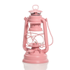 Classic-style pink galvanized oil lantern with heat-resistant glass globe and sturdy handle, perfect for camping, emergency supplies, and outdoor lighting needs.
