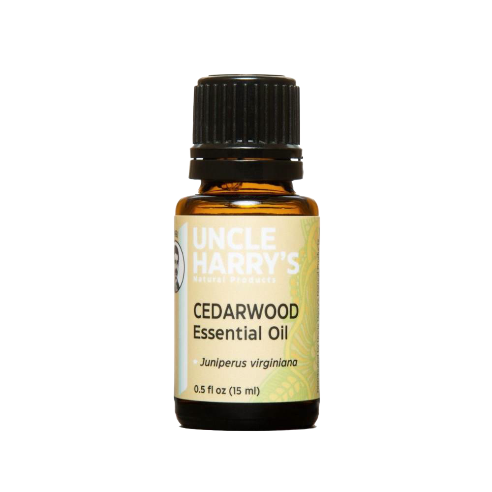 Amber glass bottle of pure cedarwood essential oil with black cap, handcrafted in USA for use in health remedies, aromatherapy, soapmaking, and candlemaking supplies.