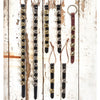 Selection of handcrafted sleigh bell door hangers with alternating brass and silver bells on black leather straps and one with brown leather, ideal for holiday decor, USA Made, Home & Decor, Best Sellers, and Promo Eligible collections.