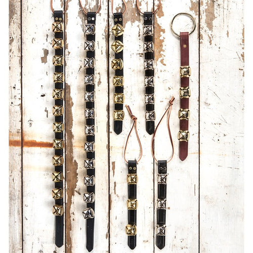 Selection of handcrafted sleigh bell door hangers with alternating brass and silver bells on black leather straps and one with brown leather, ideal for holiday decor, USA Made, Home & Decor, Best Sellers, and Promo Eligible collections.