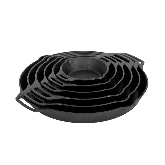 Stack of handcrafted cast iron pans with two side handles, designed for durable use in farm, garden, camping, kitchen, cookware, and cast iron collections.