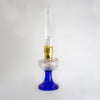 Handcrafted oil lamp with a vibrant cobalt blue glass base, clear glass font, and brass trim, blending vintage charm with modern functionality in Lamps & Lighting collections.