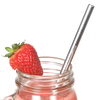 Polished stainless steel reusable straw inserted in a glass jar filled with a pink smoothie, garnished with a fresh strawberry; ideal for Kitchen & Food, Dinnerware, Kitchen Gadgets, Kitchen Accessories, Best Sellers, and Promo Eligible collections.