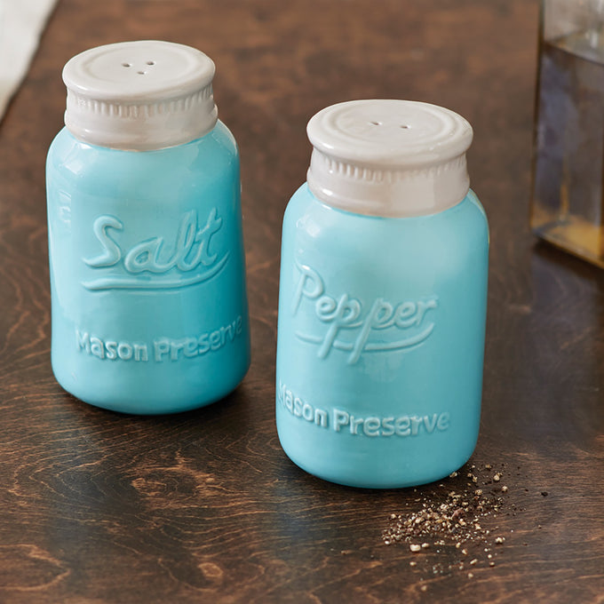 Handcrafted ceramic salt and pepper shakers with a light blue mason jar design, featuring white tops, perfect for Kitchen & Food, Dinnerware, Kitchen Gadgets, and Accessories collections.