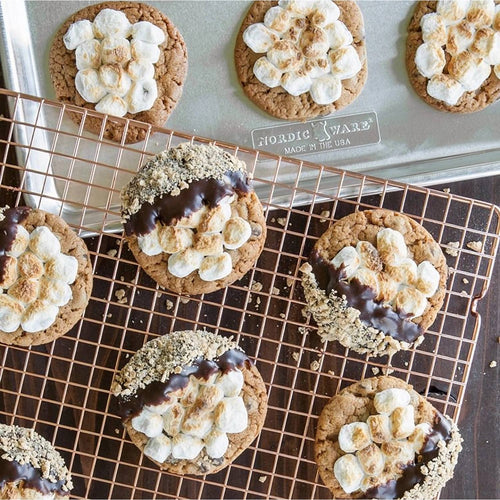 Handcrafted copper-plated cooling grid with a narrow pattern holding freshly baked cookies topped with toasted marshmallows and chocolate, ideal for Kitchen & Food, Cookware, and Baking Supplies collections.
