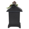 Black metal LED lantern topped with faux pine sprigs, red berries, and a pinecone, designed for cozy holiday ambiance in Home & Decor, Emergency Supplies, Holiday Decor, Best Sellers, and Promo Eligible collections.