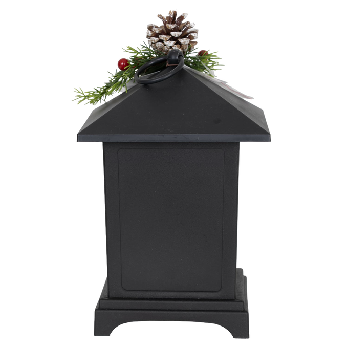 Black metal LED lantern topped with faux pine sprigs, red berries, and a pinecone, designed for cozy holiday ambiance in Home & Decor, Emergency Supplies, Holiday Decor, Best Sellers, and Promo Eligible collections.