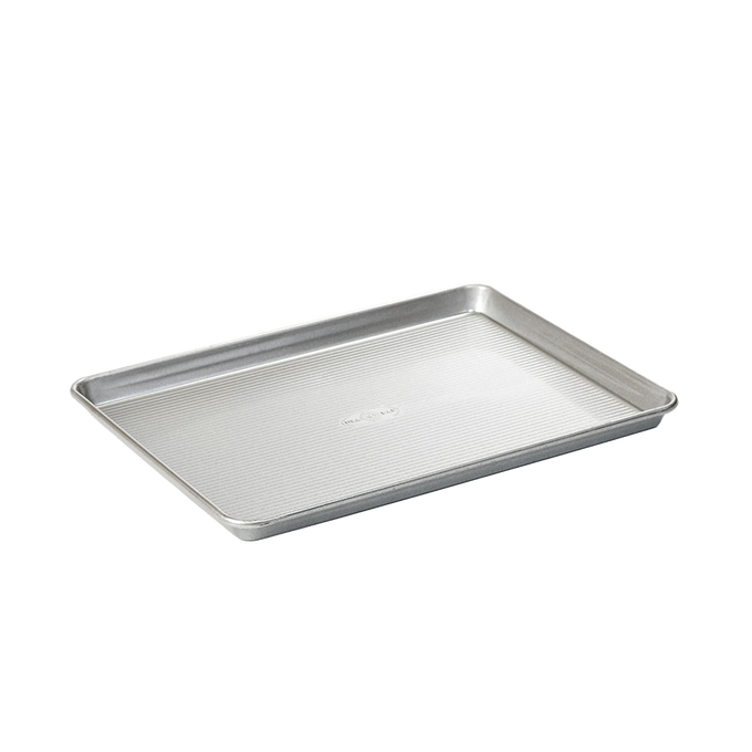 Aluminized steel jelly roll pan with ribbed surface for even heat distribution, ideal for baking cakes and pastries, part of Kitchen & Food, Baking Supplies, and USA Made collections.