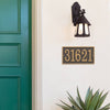 Elegant bronze and gold rectangular custom address plaque mounted on white exterior wall below a rustic black outdoor lantern, enhancing curb appeal in Home & Decor and USA Made collections.