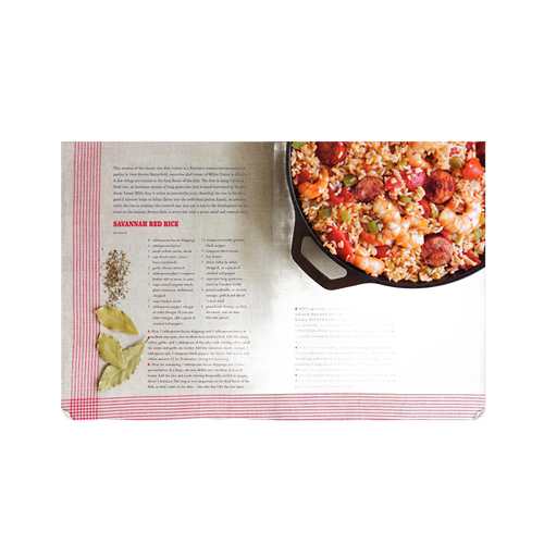 Open cookbook spread with a colorful cast iron skillet filled with savory red rice and sausage dish, featuring a rustic recipe layout and illustrated ingredient accents, ideal for Toys, Books & Games, Books, Cookbooks, and Best Sellers collections.