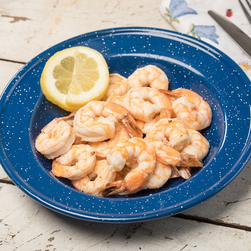 Blue speckled enamelware plate filled with peeled shrimp alongside a lemon wedge, styled on a rustic table, representing kitchen and food essentials and emergency supplies collections.