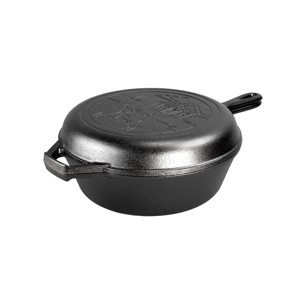 Black cast iron combo cooker featuring a rustic cabin scene imprinted on the lid, designed for camping and kitchen use, handcrafted and made in the USA.