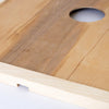Close-up of a handcrafted wooden hive inner cover with a center ventilation notch, designed for moisture control and airflow, made in the USA and Amish crafted for beekeeping supplies.