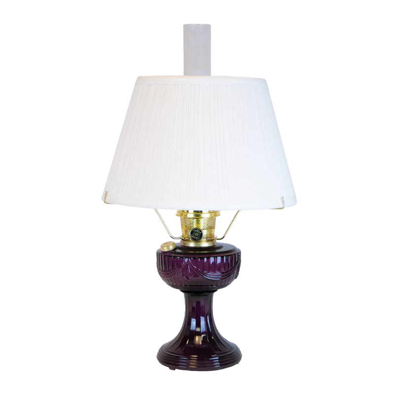 Handcrafted amethyst oil lamp with a distinctive Lincoln drape font design, brass fittings, and a 14-inch white pleated cloth shade, featured in Lamps & Lighting, Oil Lamps, and Best Sellers collections.