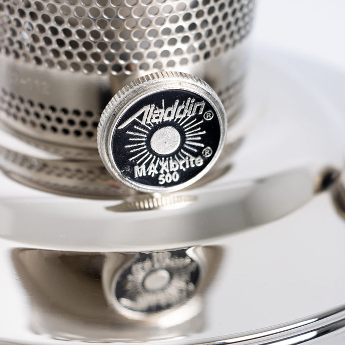 Close-up of a chrome-plated adjustment knob on a handcrafted Aladdin oil lamp, part of the Lamps & Lighting, Oil Lamps, Table Lamps, and Best Sellers collections.