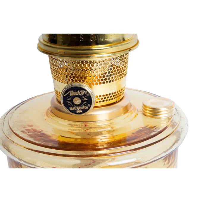 Close-up of the top portion of a handcrafted amber glass wall oil lamp with a polished brass burner and wick adjustment knob, ideal for lamps and lighting, emergency supplies, and farm tool collections.