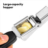 Close-up of a garlic press with a large stainless steel hopper filled with garlic cloves and a black non-slip handle, designed for comfortable use in kitchen gadgets and cooking helpers collections.