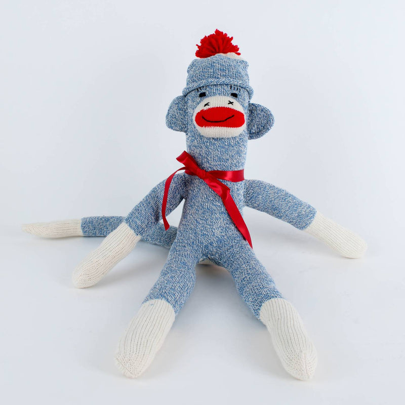 Handcrafted blue and white hand-sewn sock monkey wearing a red pom-pom hat and ribbon bow, made in USA, featured in Toys, Books & Games, Children's Toys, Indoor Play, and Best Sellers collections.