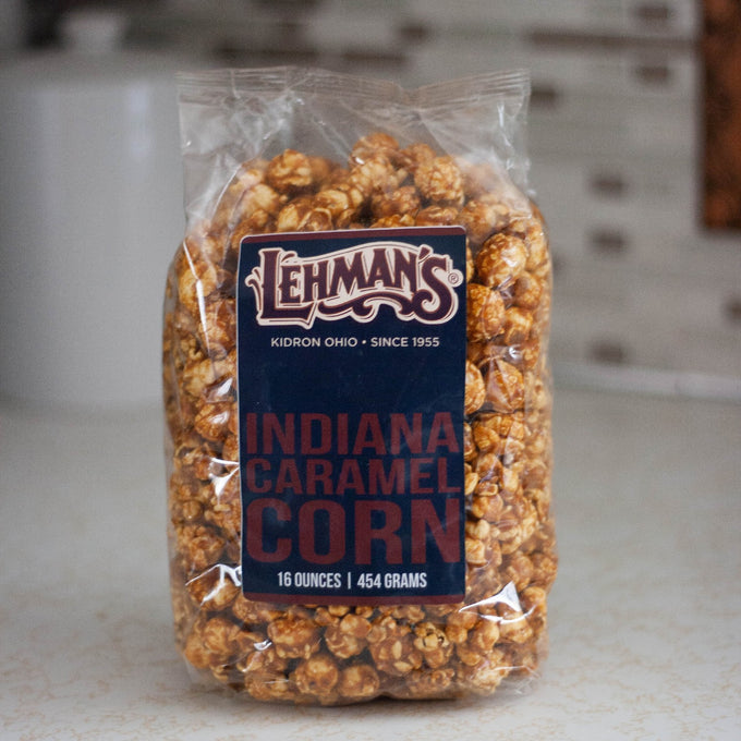 Clear bag of handcrafted caramel popcorn in Indiana caramel corn flavor, a unique sweet and crunchy snack made in USA, perfect for Kitchen & Food, Snacks and Sweets, Popcorn, USA Made, Best Sellers, and Promo Eligible collections.