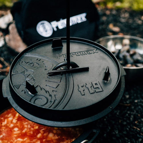 Heavy-duty cast iron Dutch oven lid embossed with a sun motif and Petromax logo, designed for outdoor and indoor cooking in Kitchen & Food, Cookware, Cast Iron, Best Sellers collections.