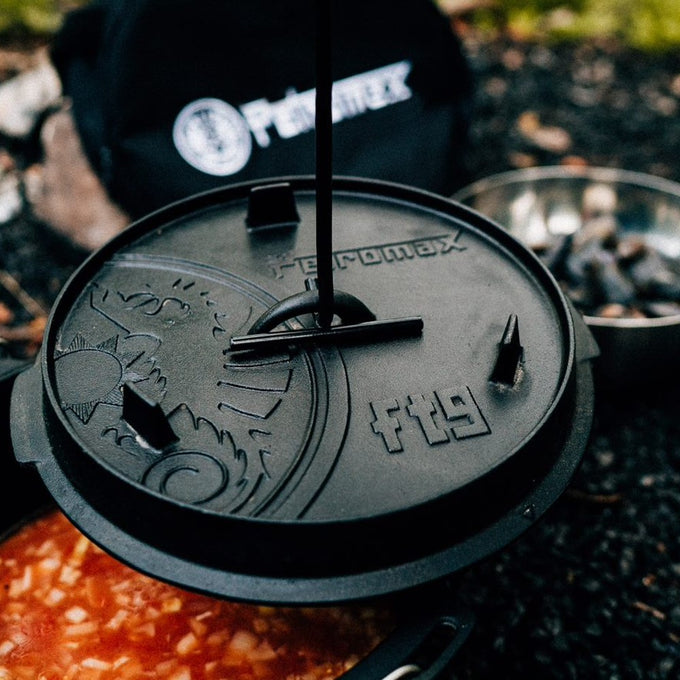 Heavy-duty cast iron Dutch oven lid embossed with a sun motif and Petromax logo, designed for outdoor and indoor cooking in Kitchen & Food, Cookware, Cast Iron, Best Sellers collections.
