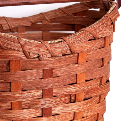 Close-up of a handwoven maple wood basket with tight weaving and braided rim details, handcrafted in the USA by Amish artisans, featured in Home & Decor and Household Helpers collections.