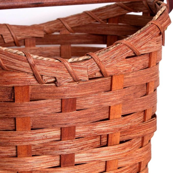Close-up of a handwoven maple wood basket with tight weaving and braided rim details, handcrafted in the USA by Amish artisans, featured in Home & Decor and Household Helpers collections.