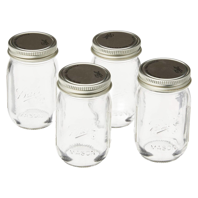 Set of four clear mini glass jars with silver metal lids, handcrafted in the USA, perfect for storage and organization in Home & Decor and Kitchen & Food collections.