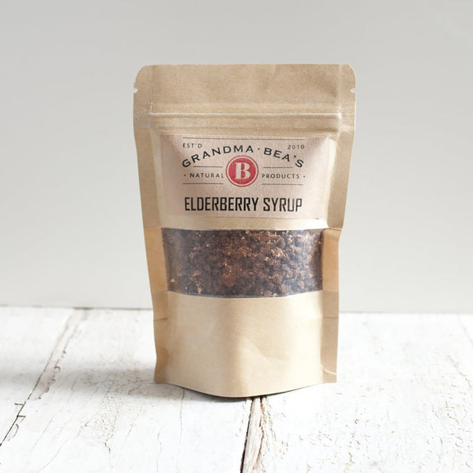 Brown kraft resealable pouch of natural elderberry syrup mix made in USA, part of Health & Wellness and Kitchen & Food collections, packaged for easy syrup preparation.