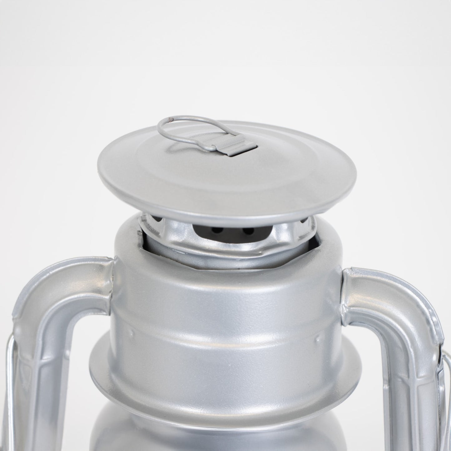 Close-up of the top vent and cap on a handcrafted silver metal lantern with a weather-resistant finish, designed for dependable lighting in Farm, Garden & Tool, Camping, and Emergency Supplies collections.